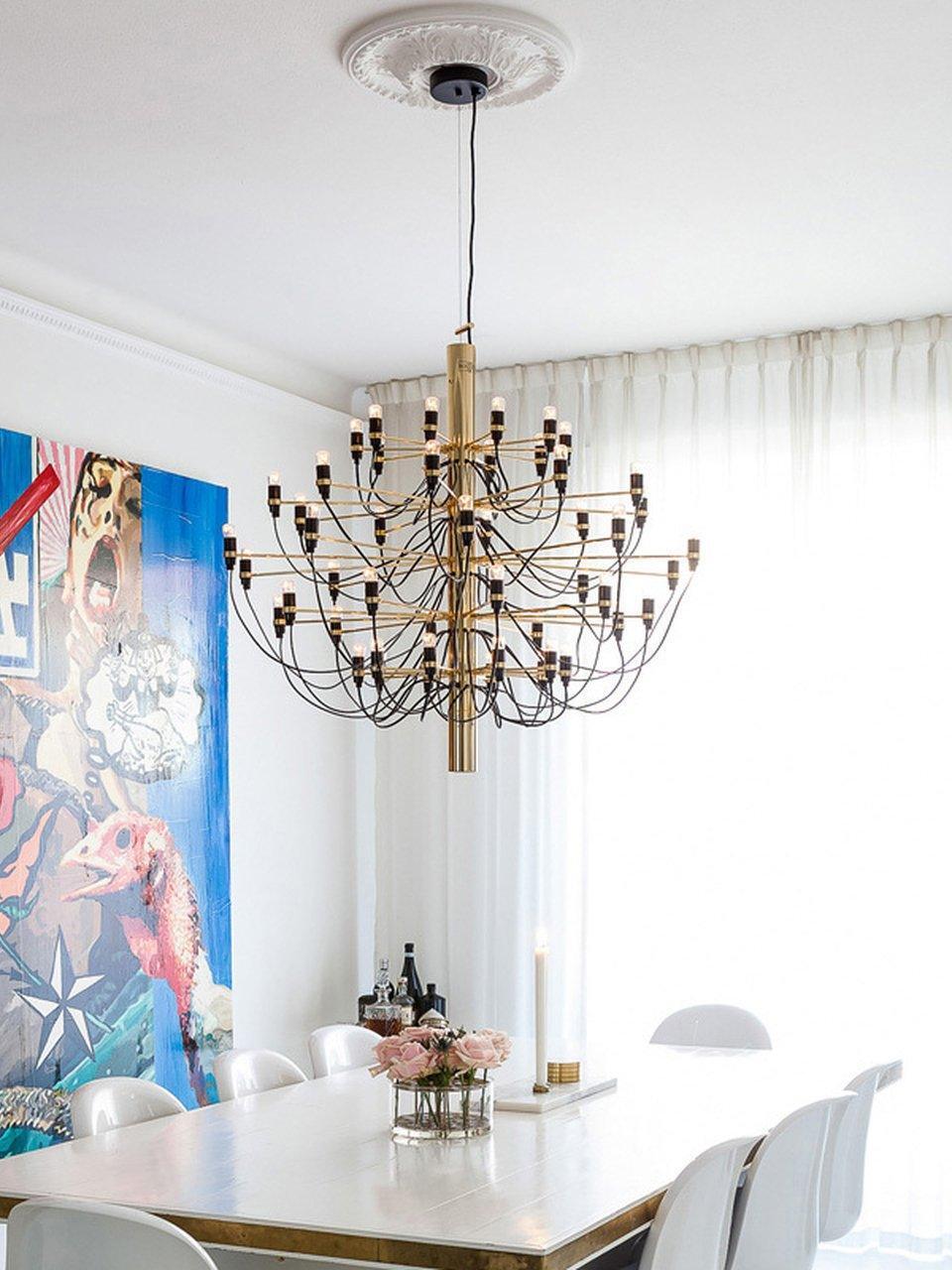 Multi-tier chandelier above a dining table