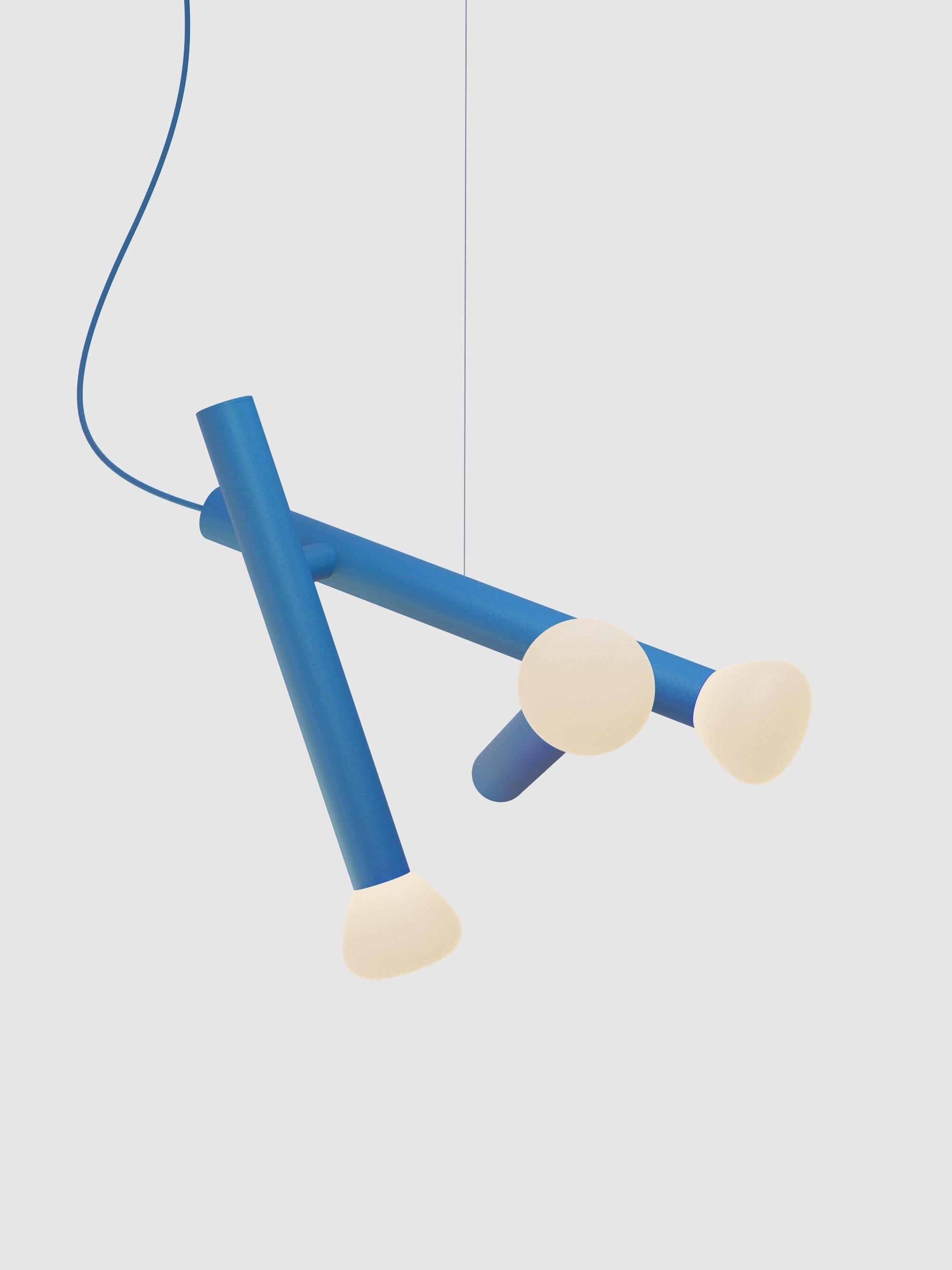 Blue three-head tube pendant on a pale background