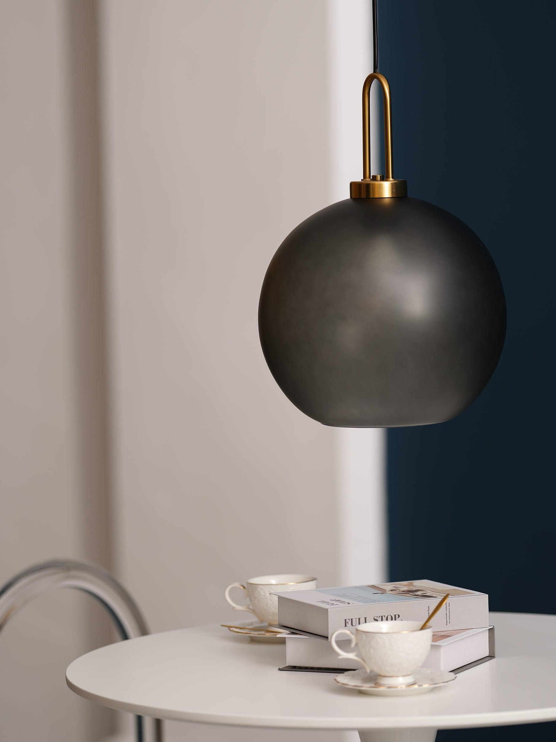 Glass globe beside a window and round table