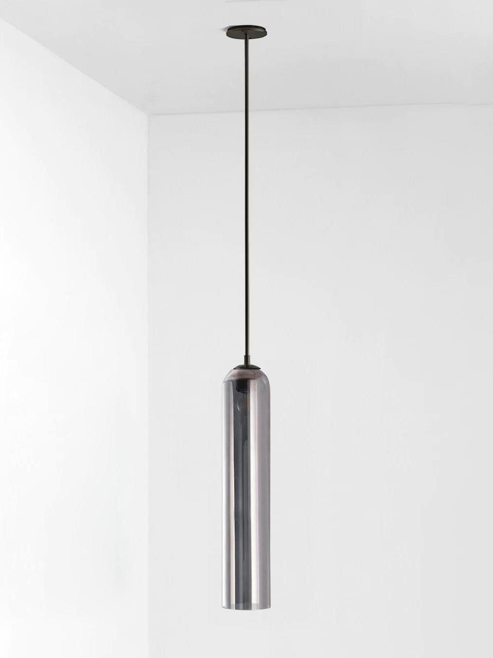 Silver gray glass Long Tube pendant with black rod and canopy, with reflections across the cylindrical shade