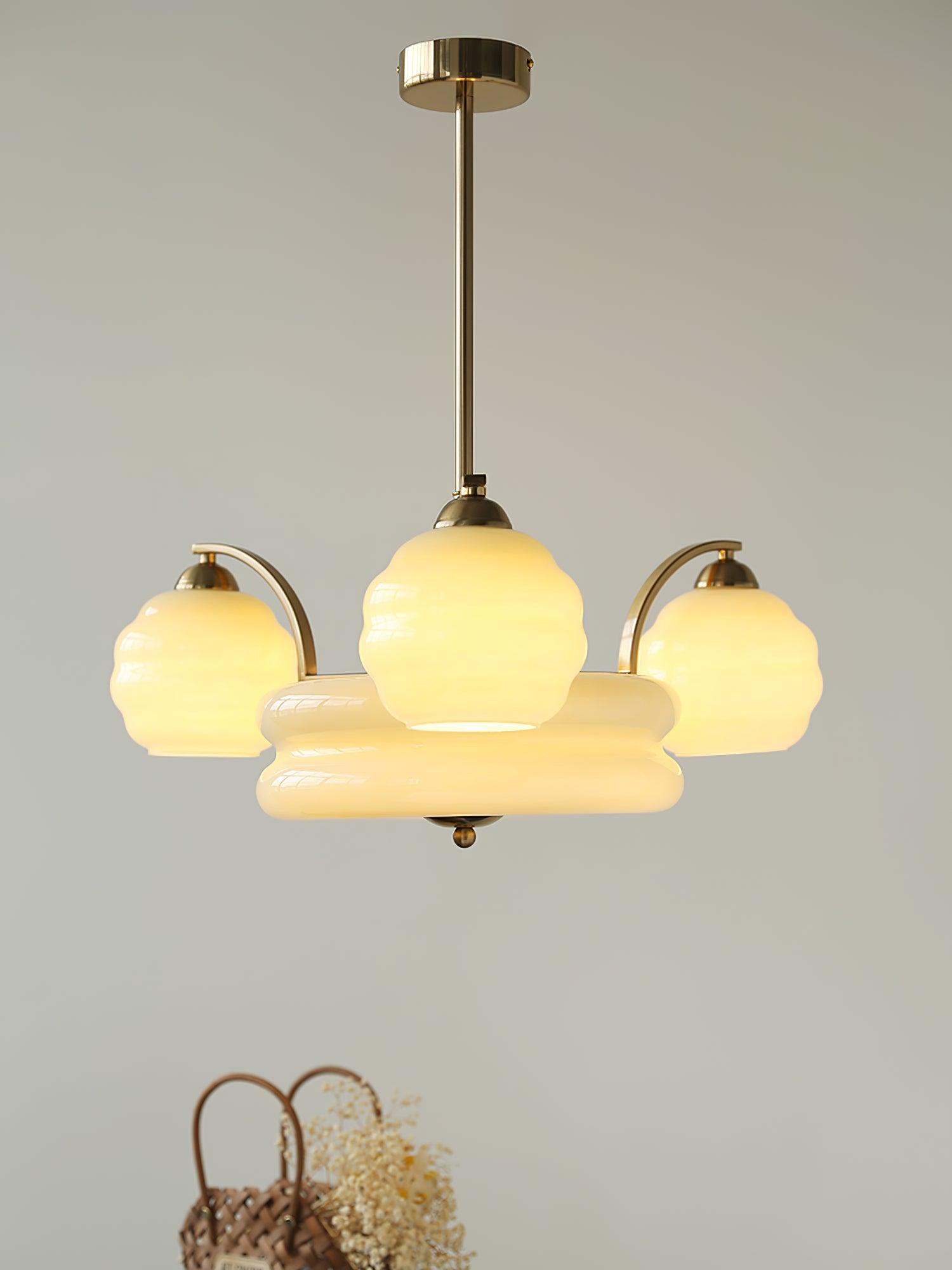Glass chandelier above a table with a handbag