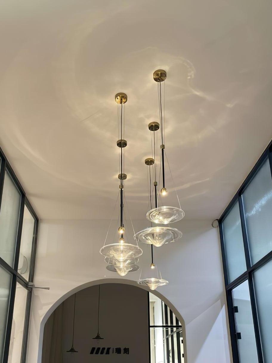Glass disc pendants along pale interior ceiling