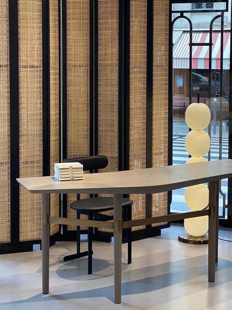 Stacked-globe floor lamp near a dining table