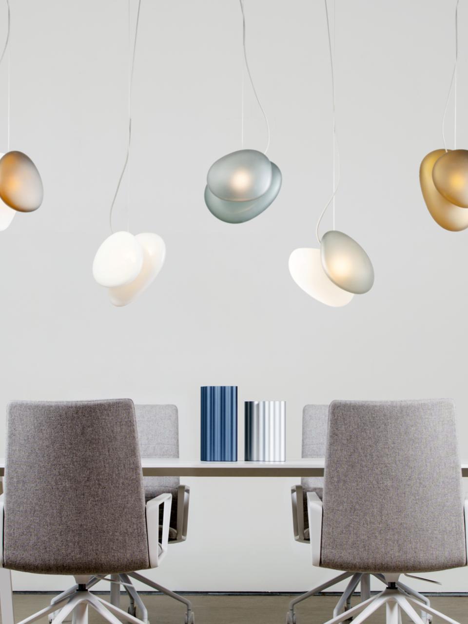 Pale pebble pendants suspended over two chairs