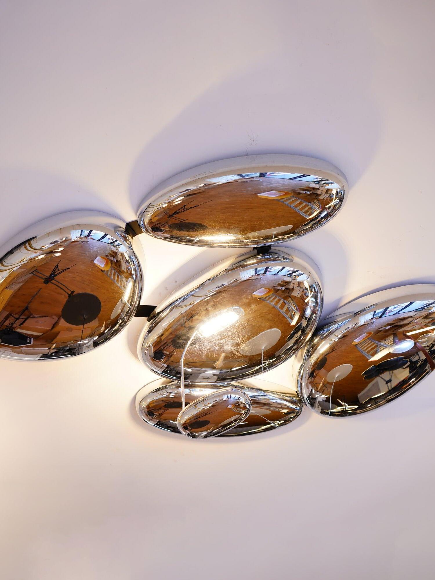 Angled reflective cluster with broad central pebble and smaller rounded forms