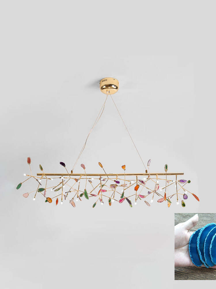 Long linear reference chandelier with blue stone inset
