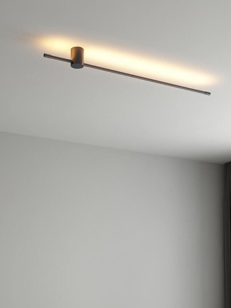 Single horizontal rod casting light along a wall