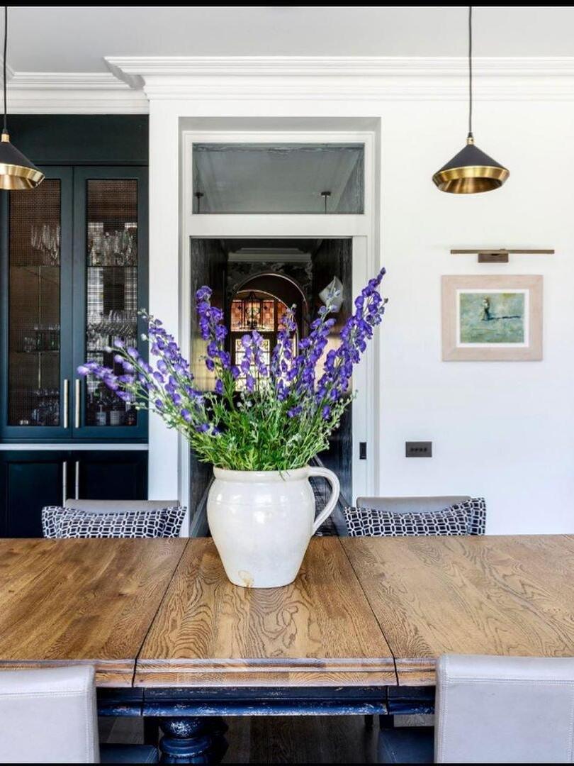 Small cone pendant above a wooden dining table