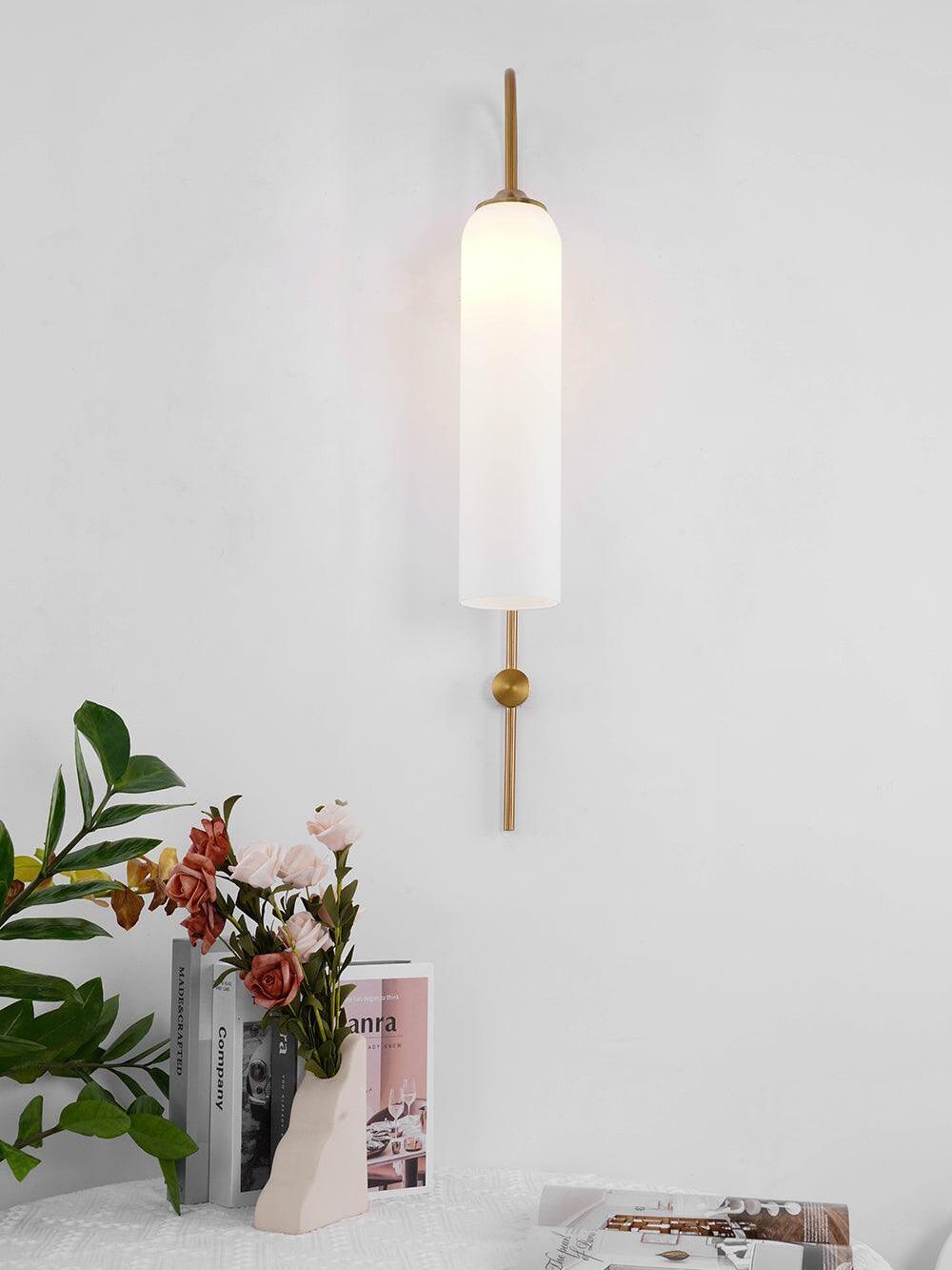 Front view of a white cylindrical wall shade