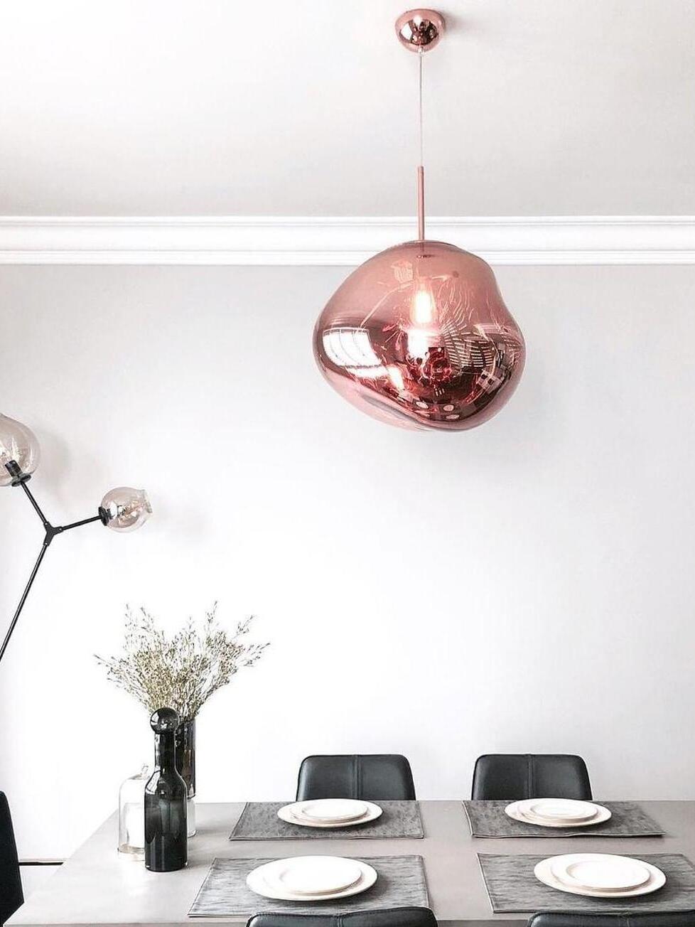 Single reflective shade above a set table