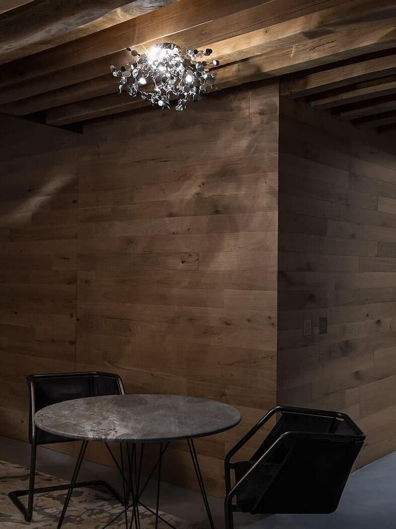 Silver disc cluster in a room with timber ceiling beams