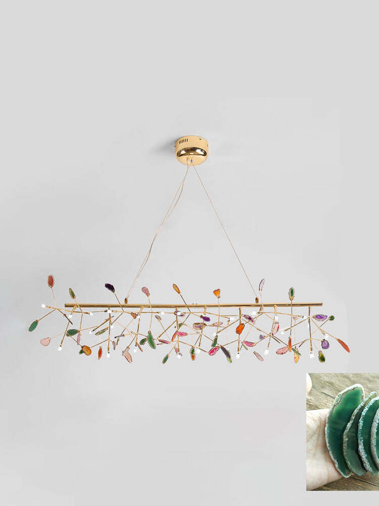 Long linear reference chandelier with green stone inset