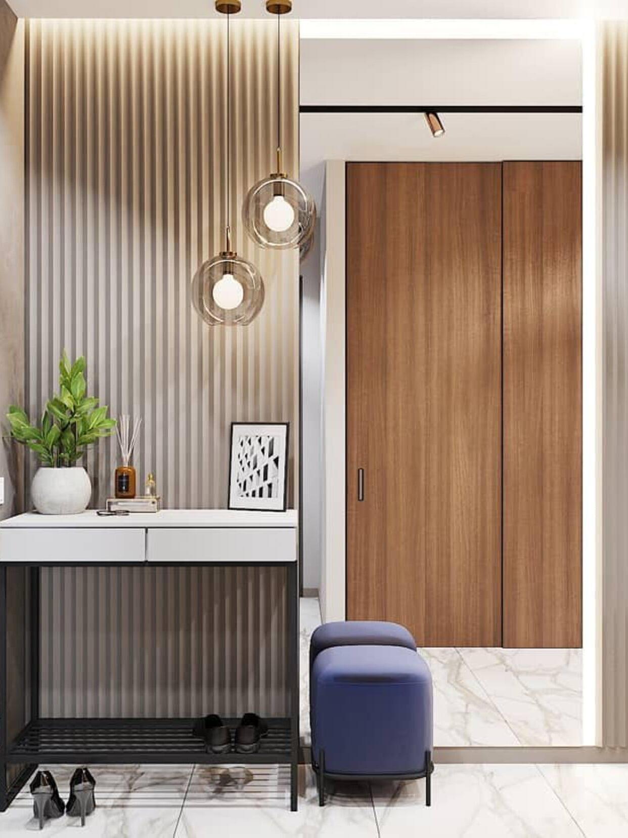 Clear globe pendants beside a wood-panelled doorway