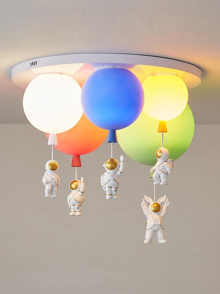 Illuminated five-balloon arrangement with central blue shade