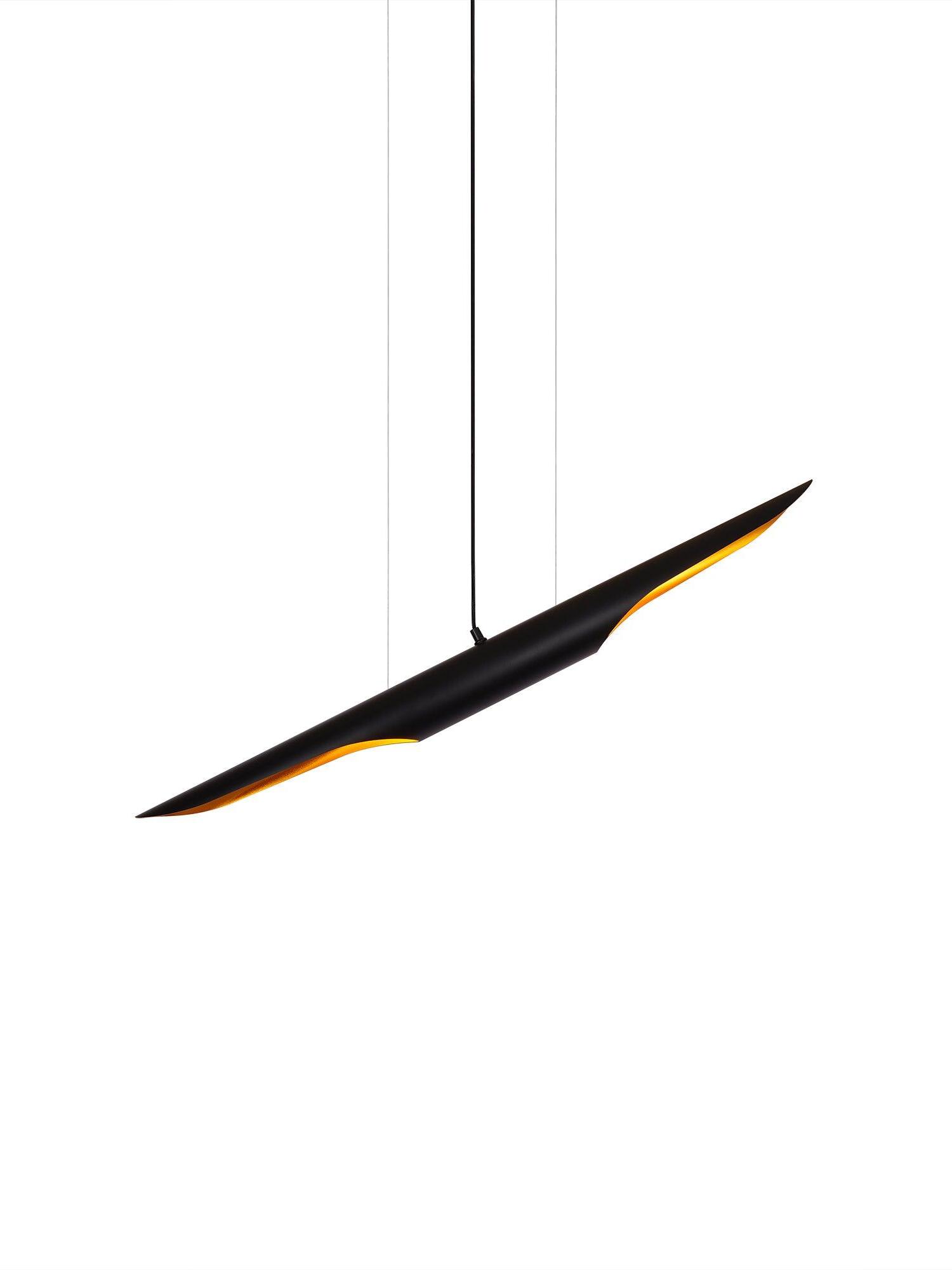 Black and gold pipe pendant on two thin suspension wires and a central cable against white