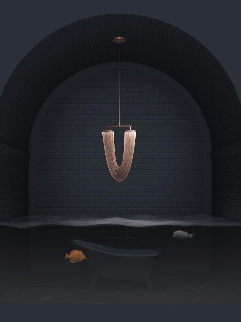 Small rose-gold chain pendant in a dark alcove scene