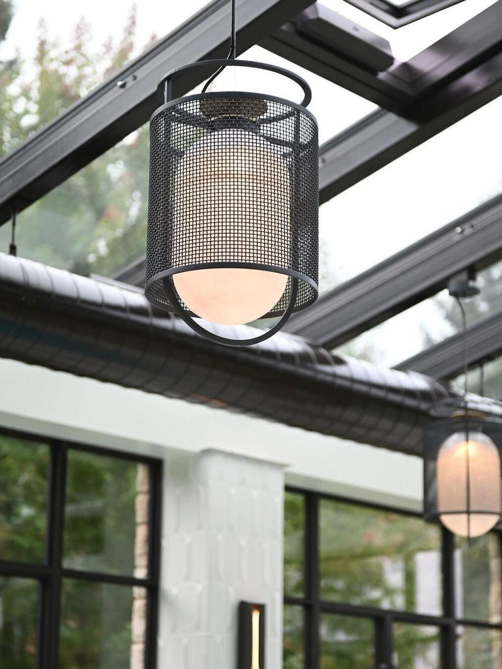 Two black lantern pendants beneath a glazed roof