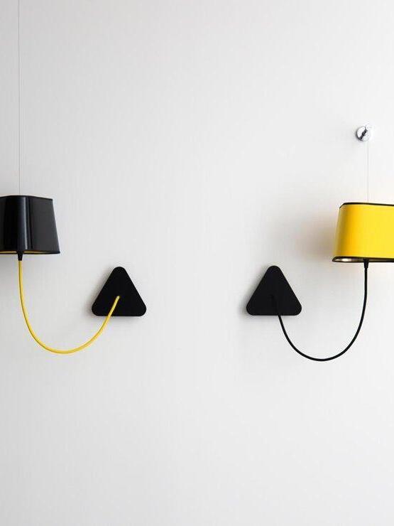 Two suspended wall shades with looped cords