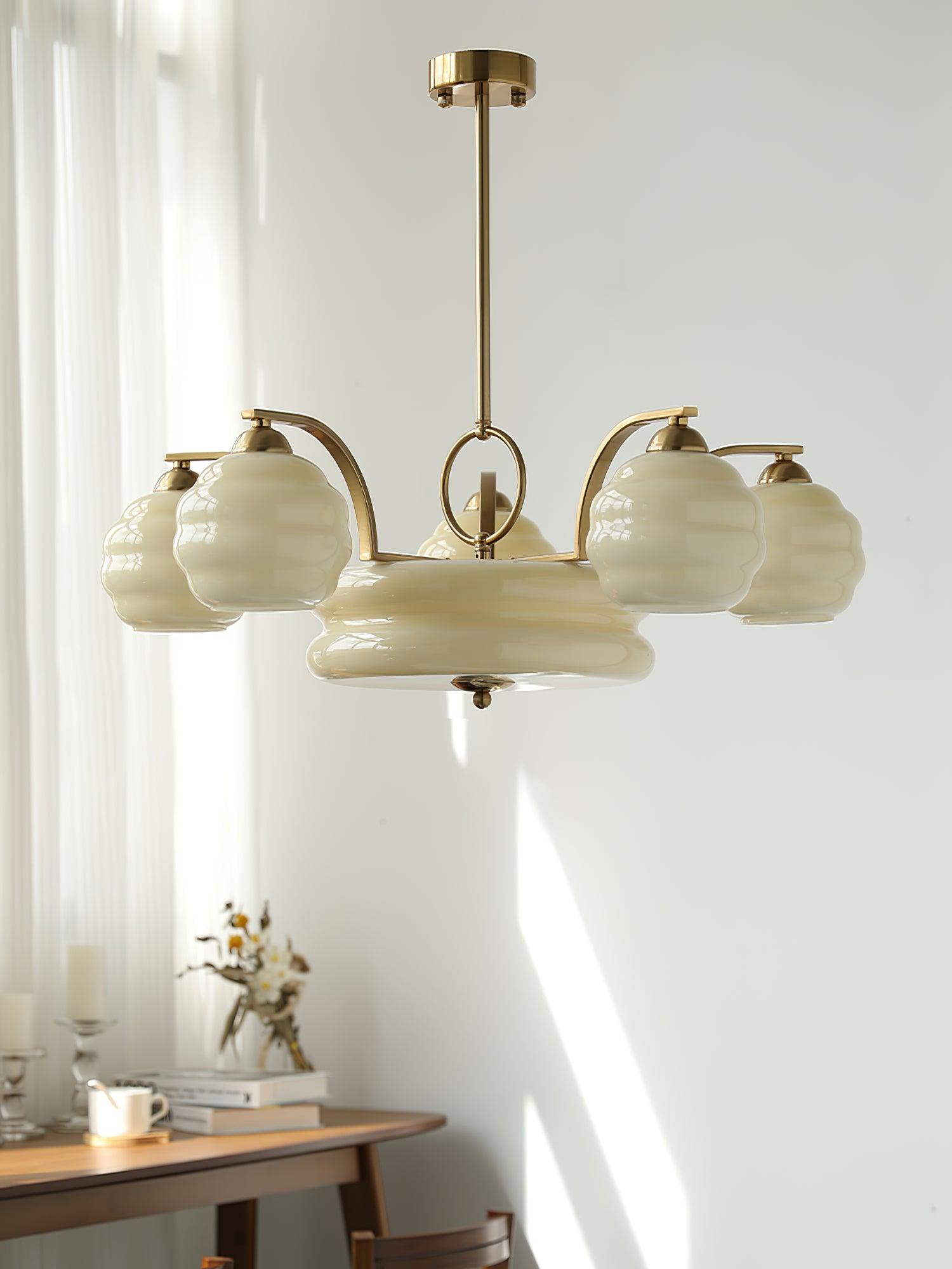 Beige glass chandelier near a bright window