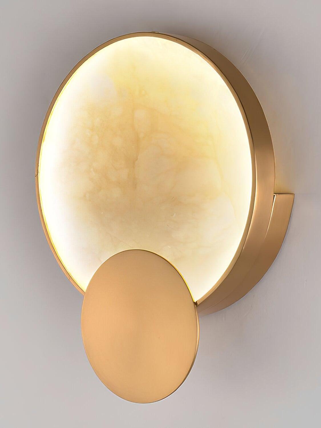 Angled view of the illuminated stone face and metal rim