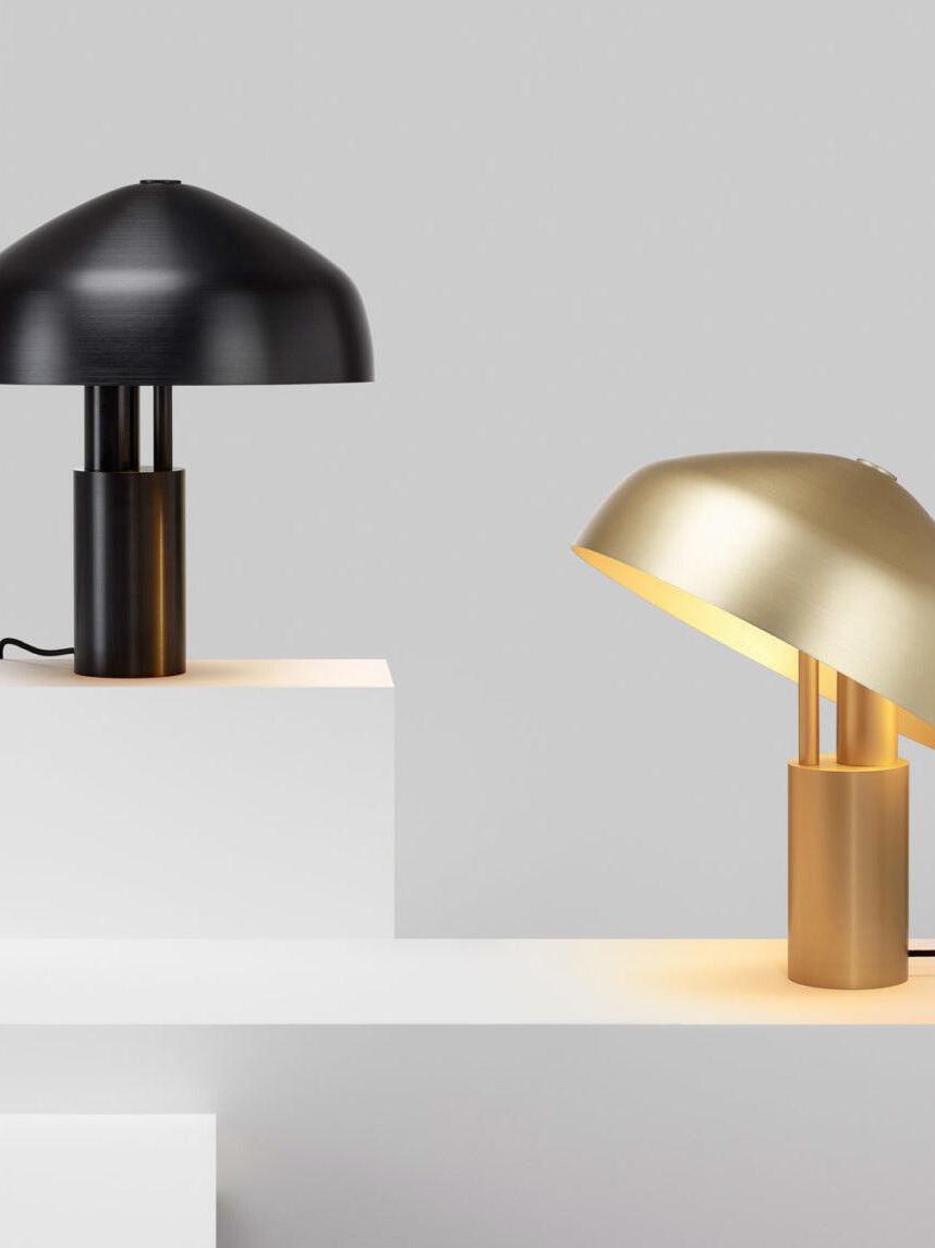 Black and gold metal dome lamps shown together