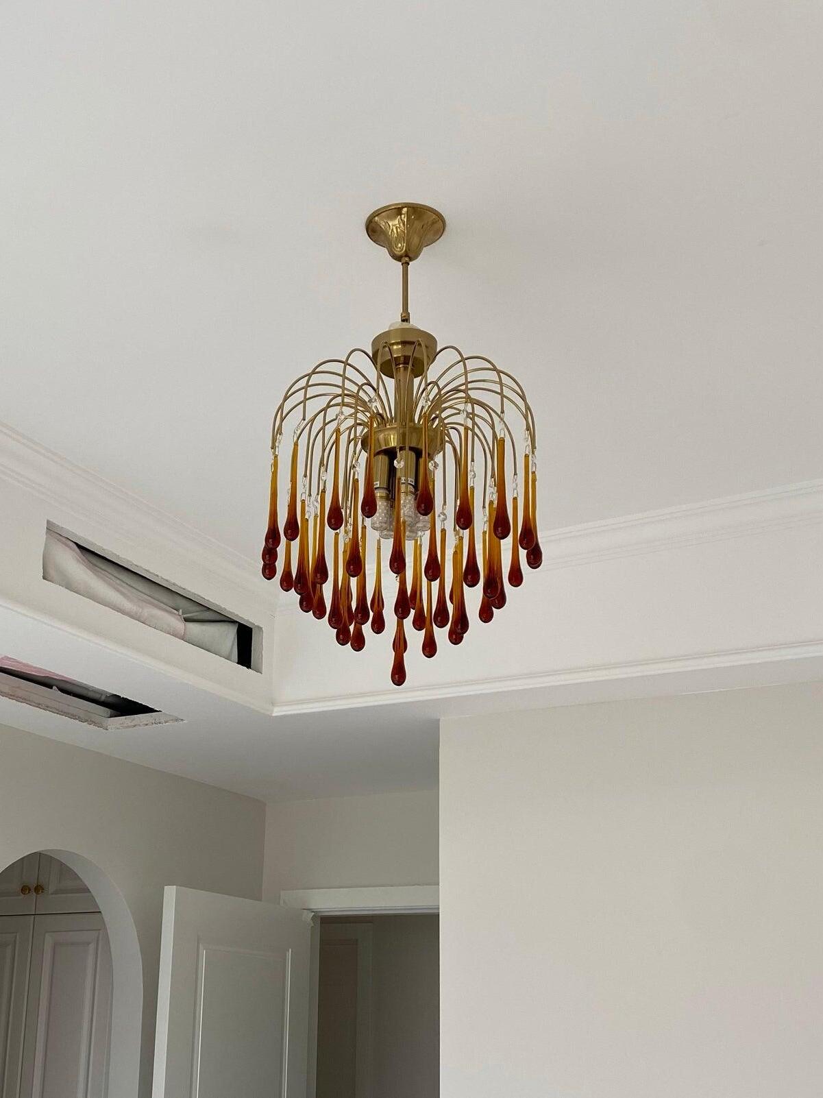 Compact chandelier in an indoor ceiling setting
