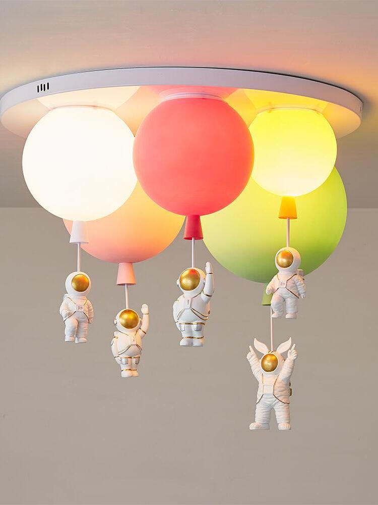 Five-balloon red-centred arrangement illuminated