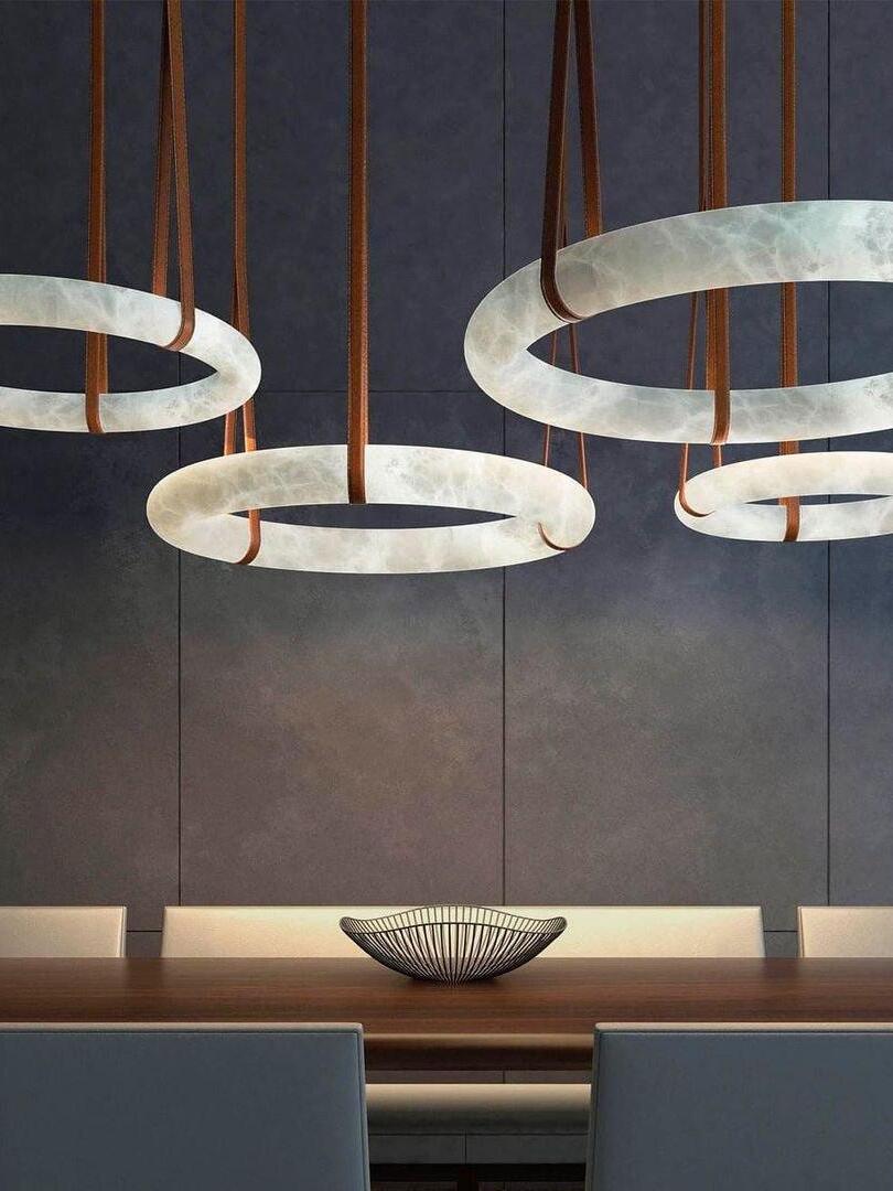 Multiple alabaster rings above a table