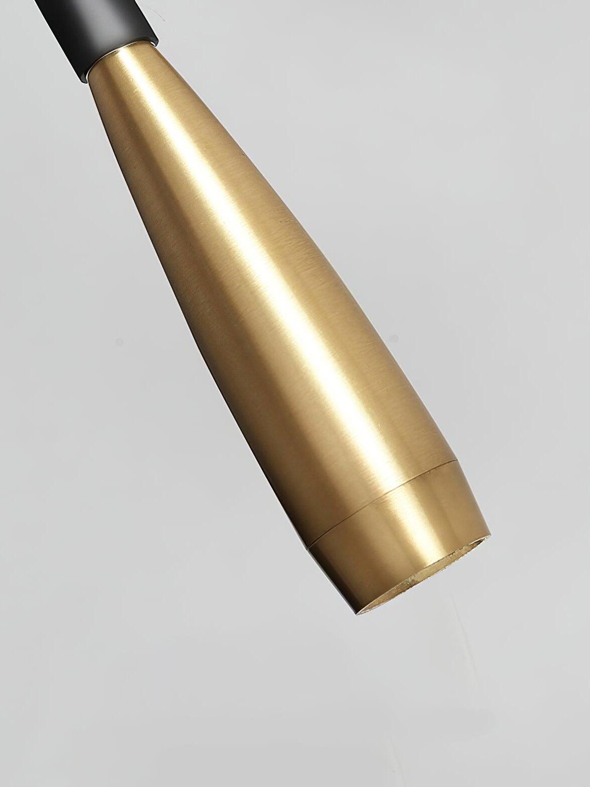 Close gold tapered Flexi light head at the dark arm joint, showing surface striations and a seam near the tip