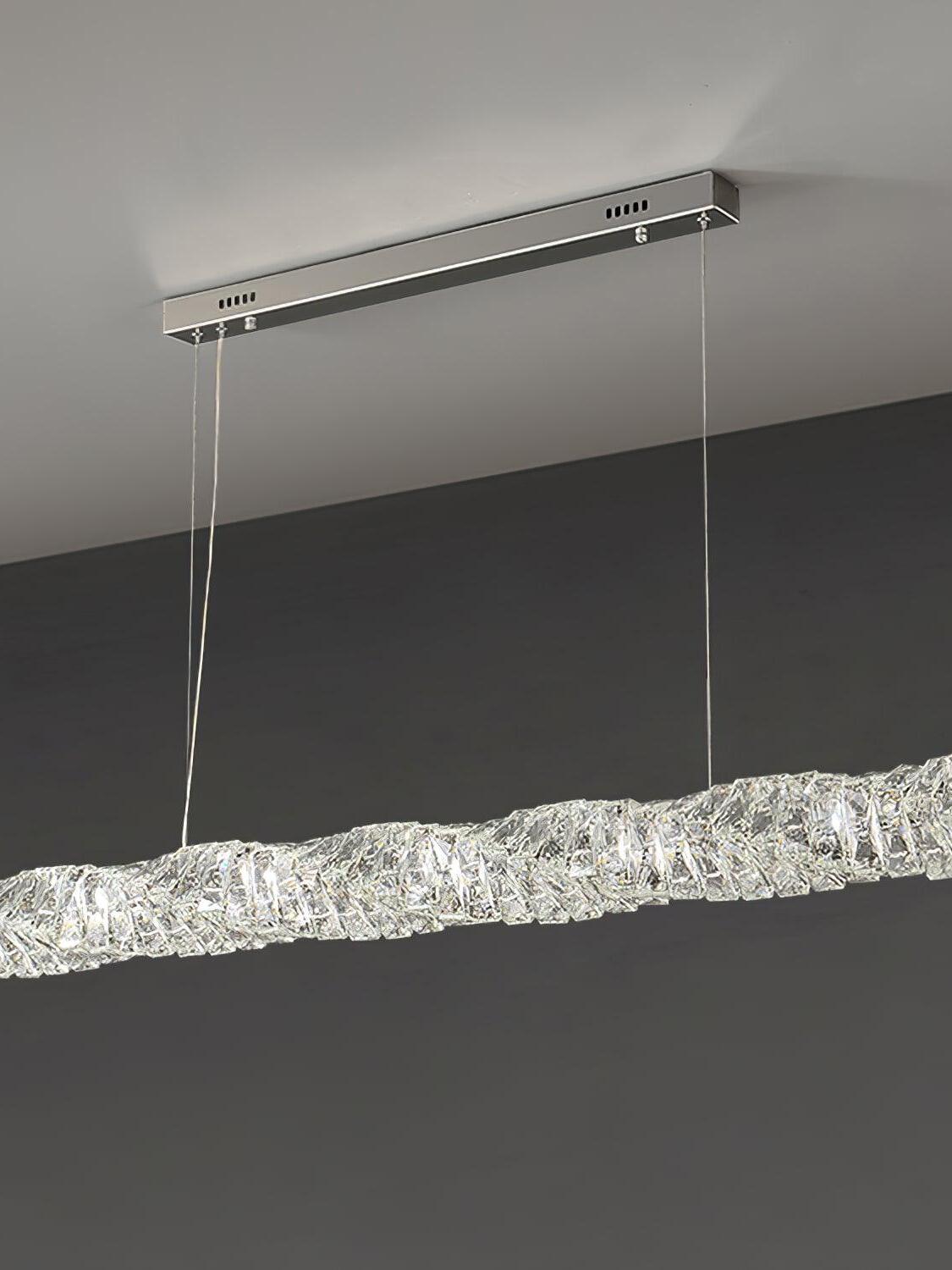 Angled view of the chrome canopy and crystal bar emitting cool-looking light