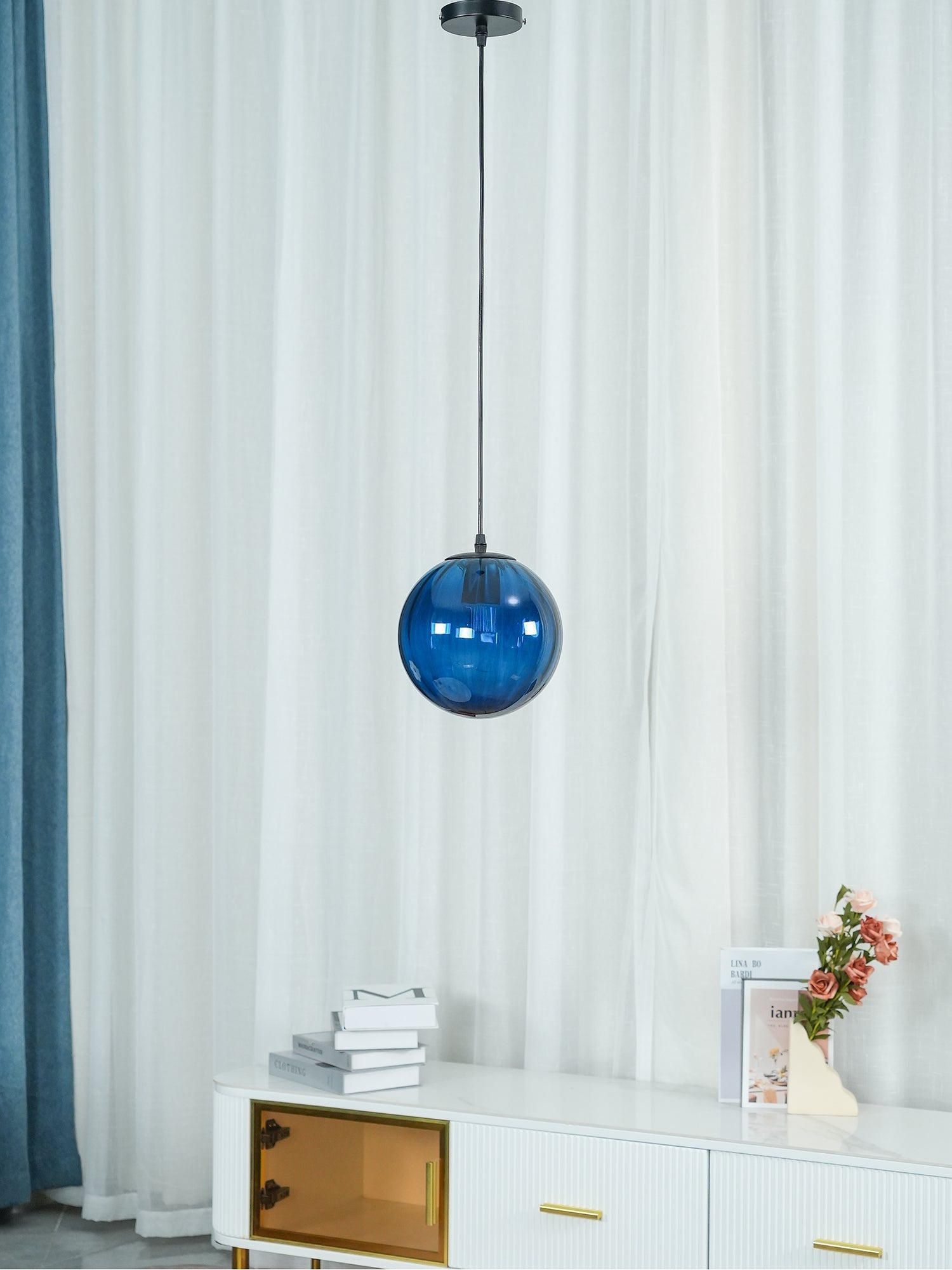Dark blue globe in an indoor cabinet setting