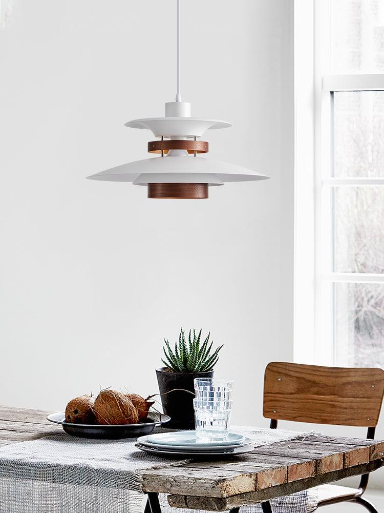 Layered pendant over a dining setting