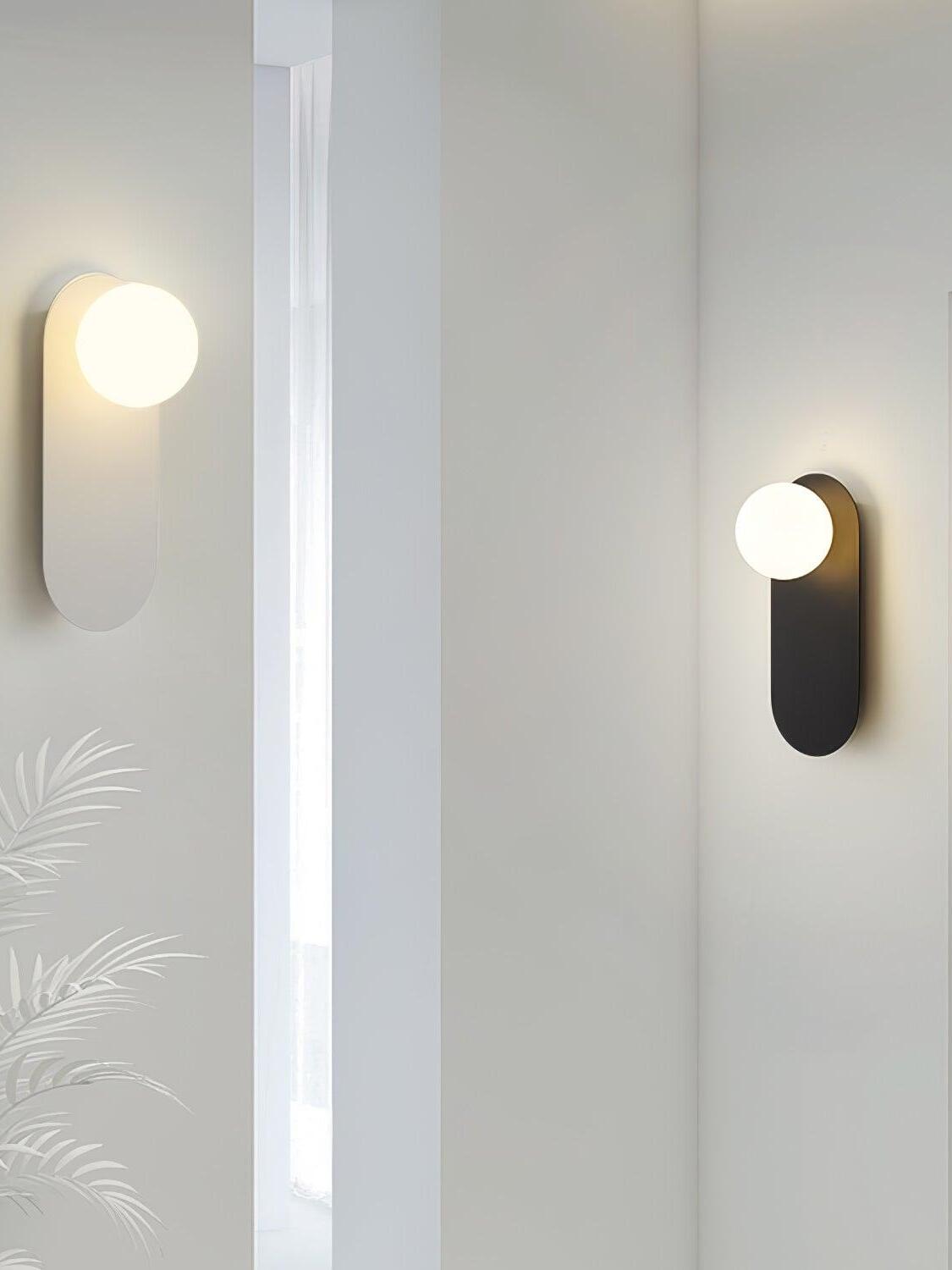 Globe sconces pictured near an interior window