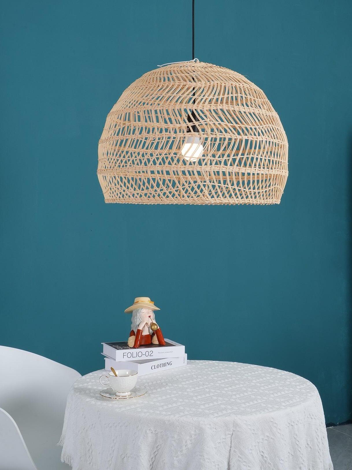 Natural basket pendant against a blue wall