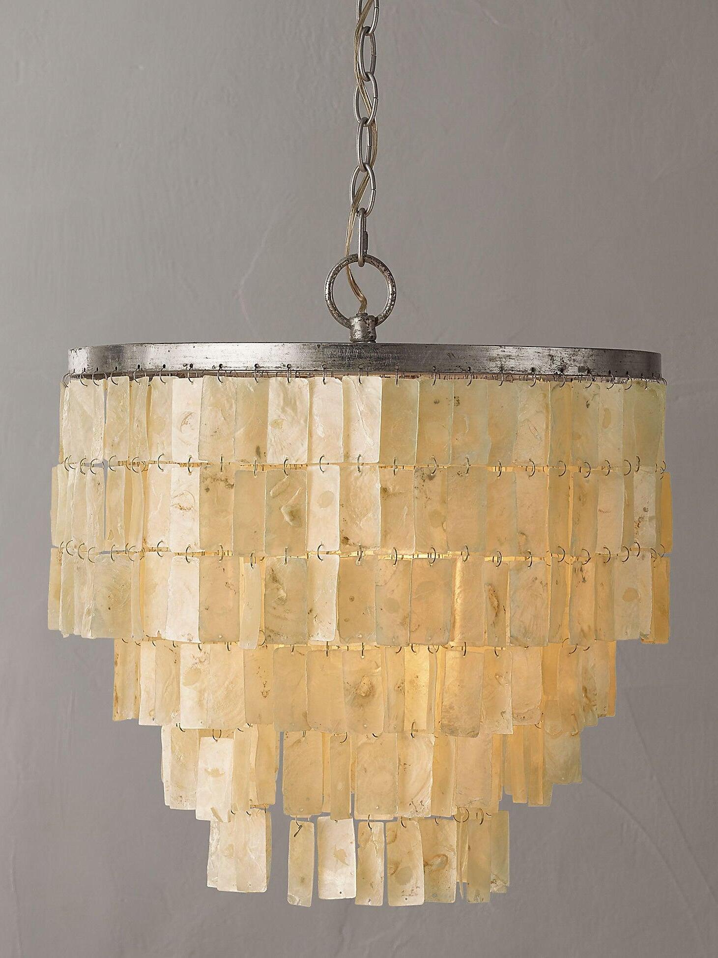Skye shell pendant illuminated with a warm glow