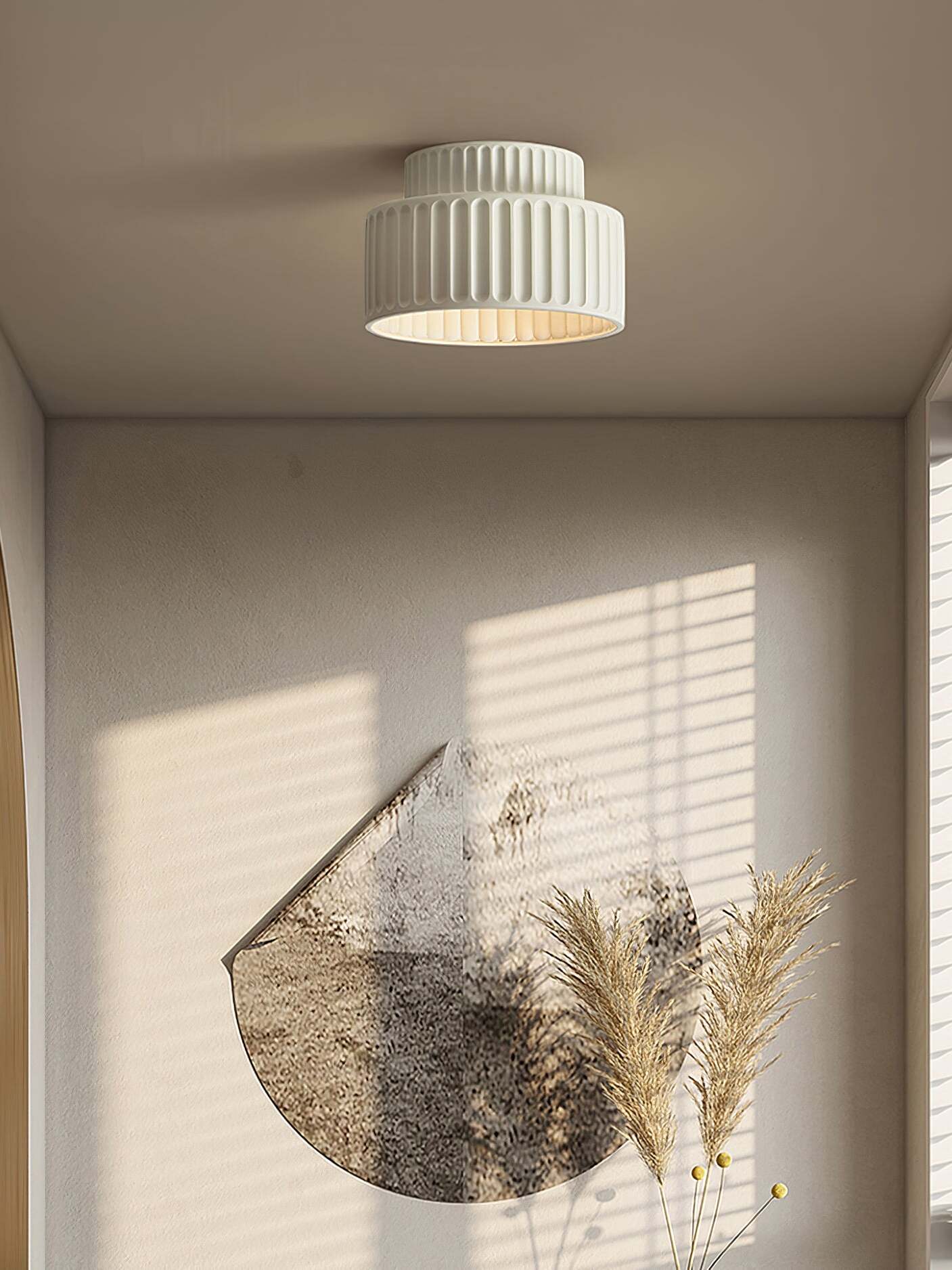 Single pale ribbed ceiling lamp in sunlit room