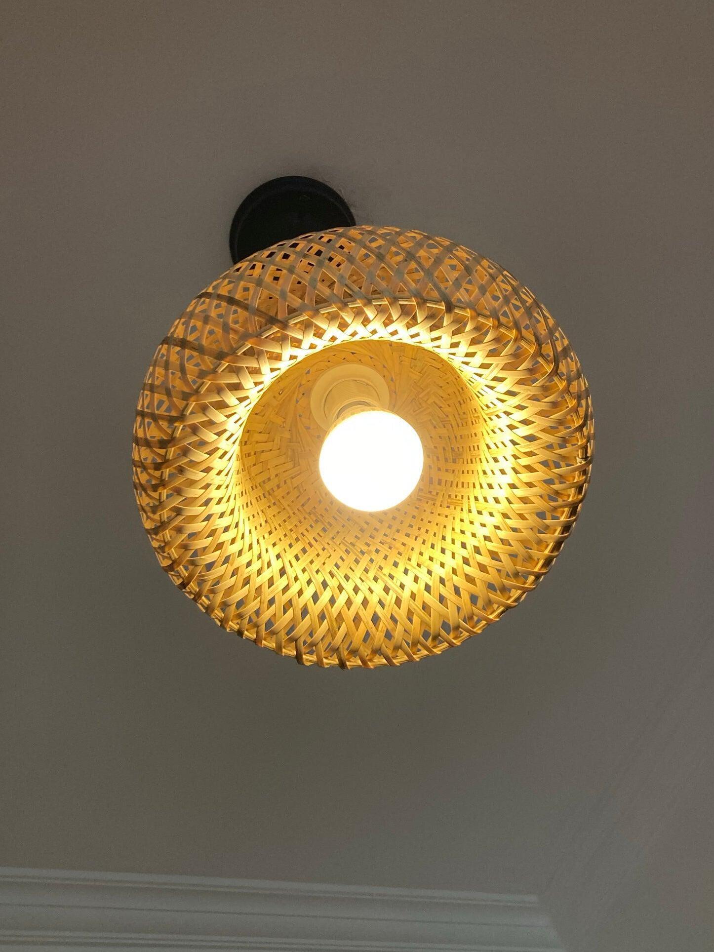 Direct upward view of illuminated bamboo dome