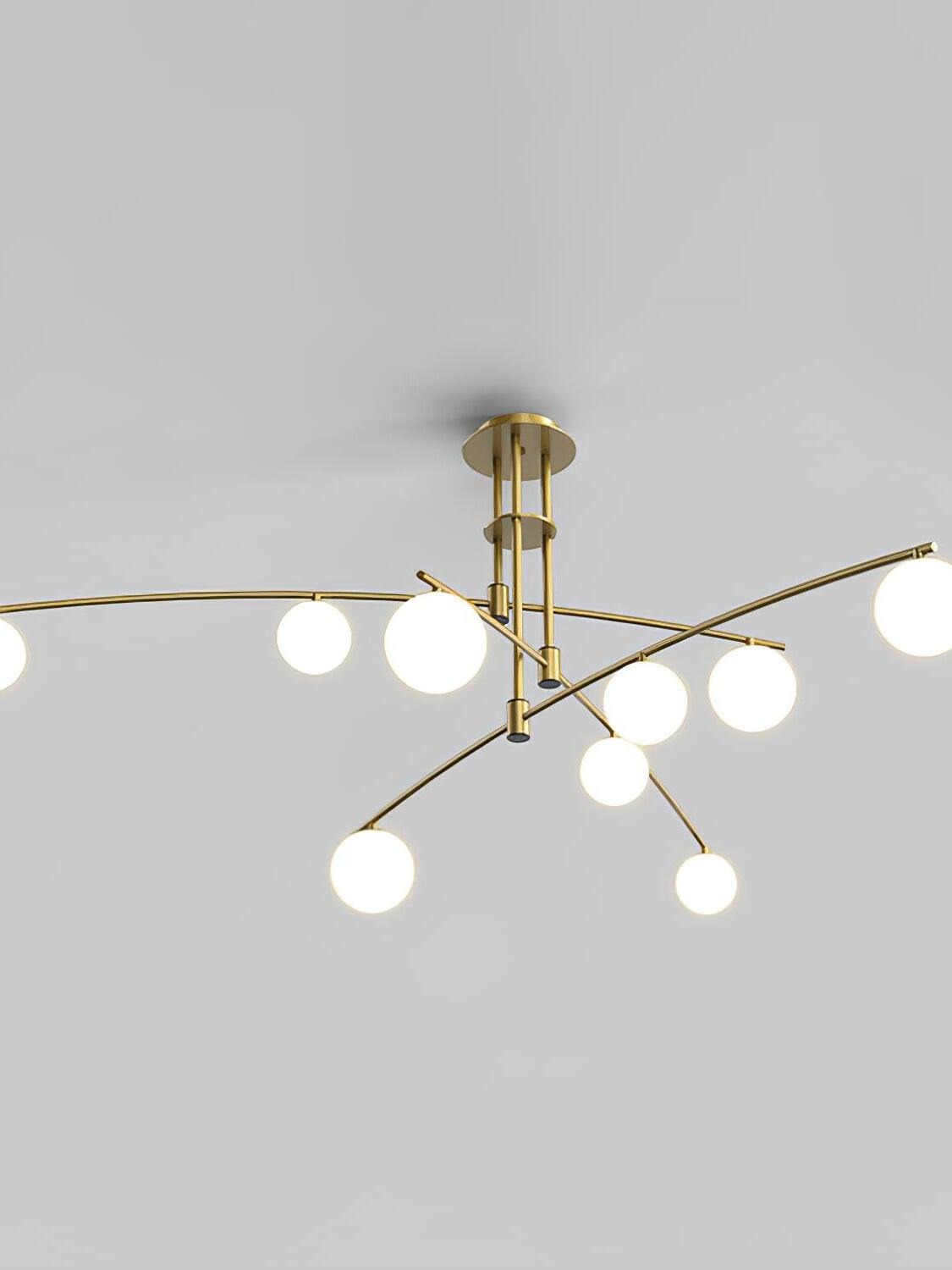 Gold Long Arm chandelier with nine white glass globes on crossing curved arms