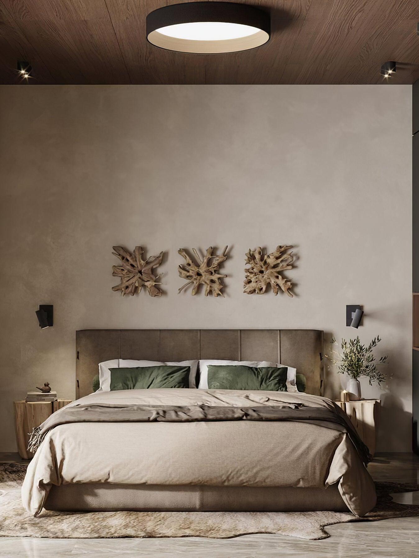 Single round light above bedroom bed