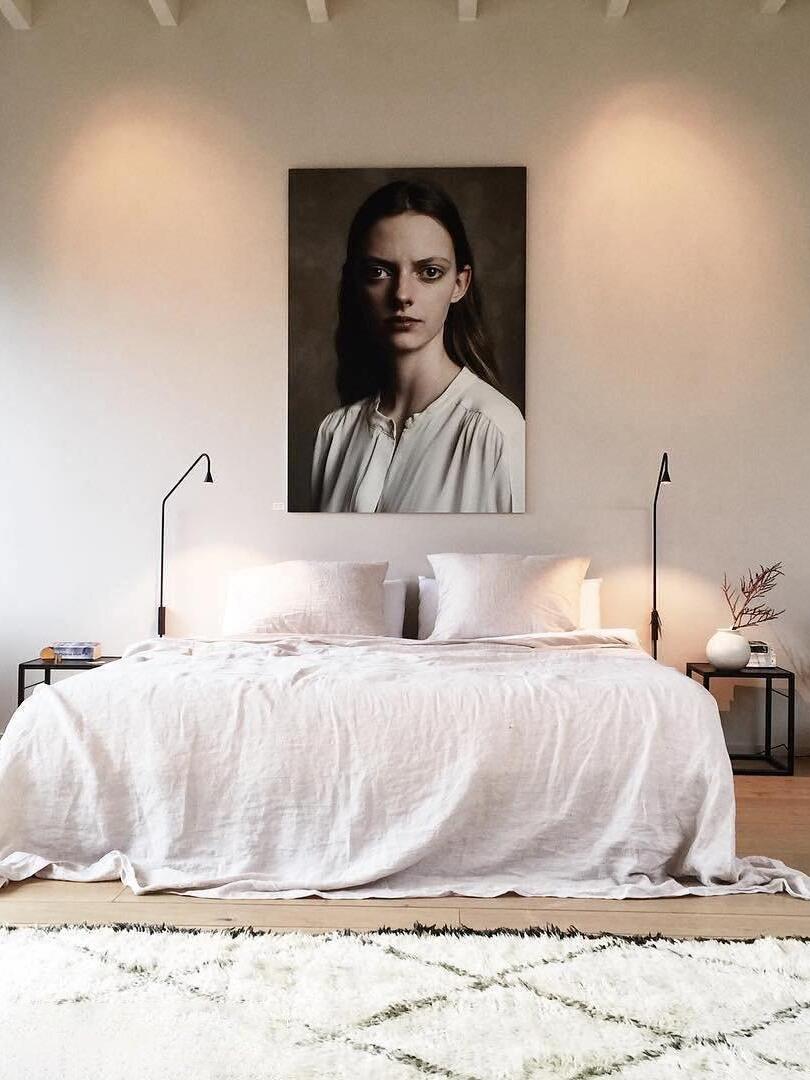 Pair of slender lights beside a double bed