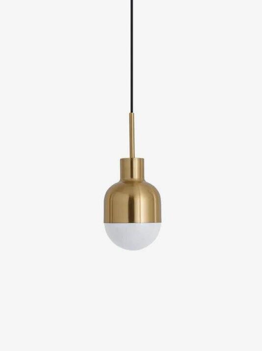 Isolated Niku pendant with rounded gold-tone housing, white lower hemisphere and black cord against white