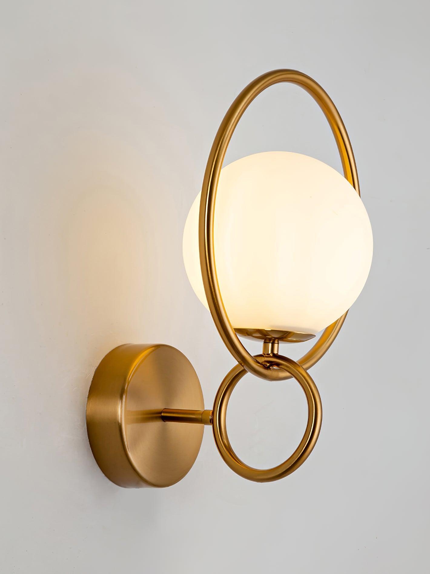 Side view of white globe framed by gold oval