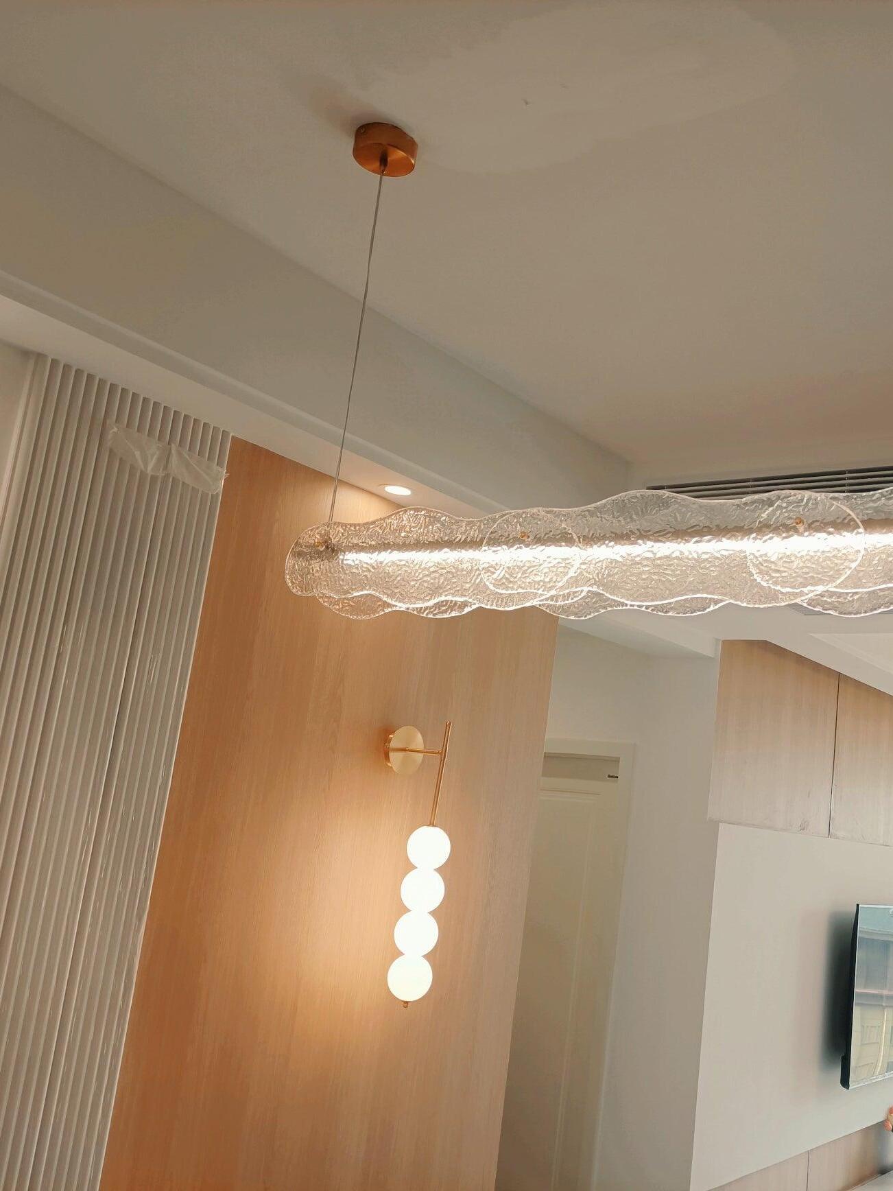 Candied Haws wall light in a room with a separate ceiling fixture