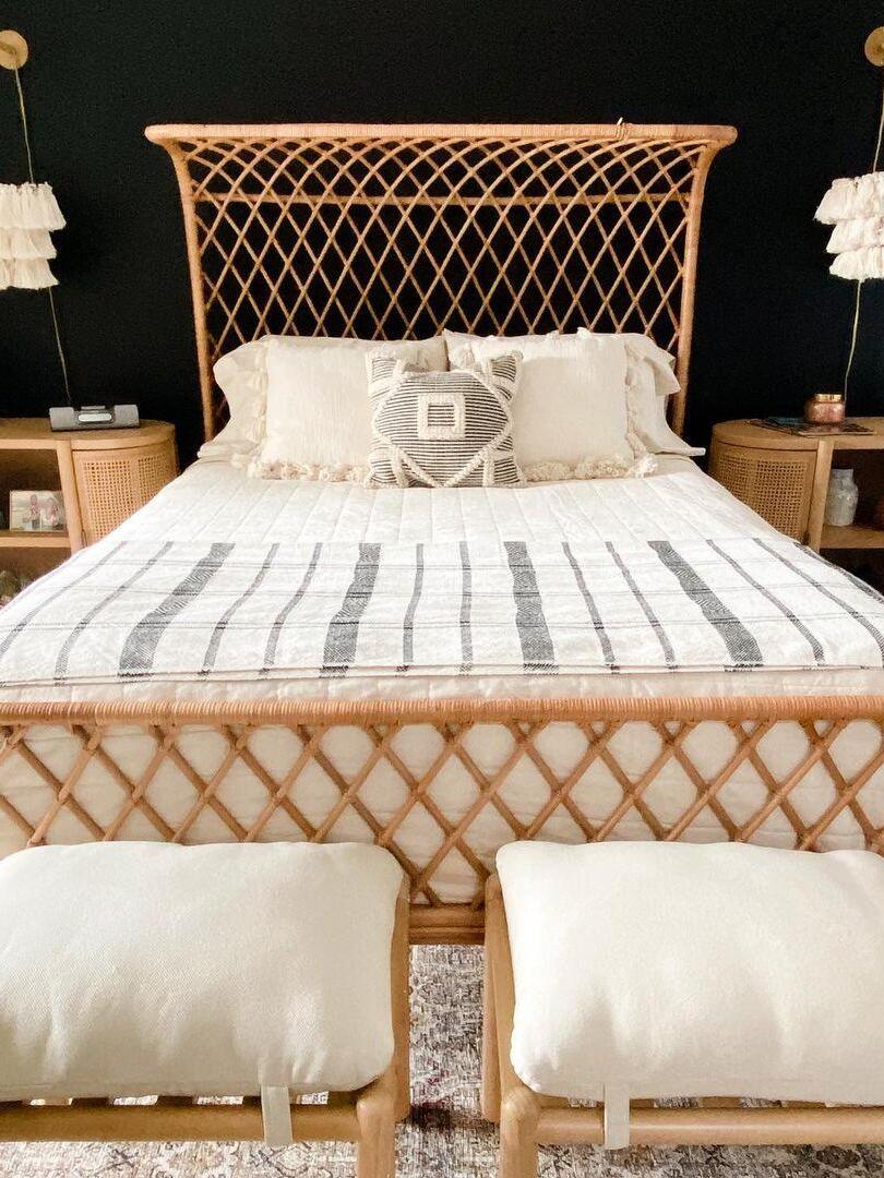 White tassel lights on both sides of a bed