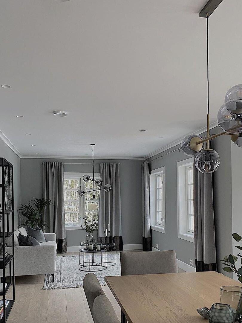 Globe chandelier in a long dining room