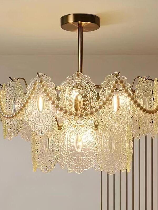 Smaller clear-ornament chandelier with gold frame