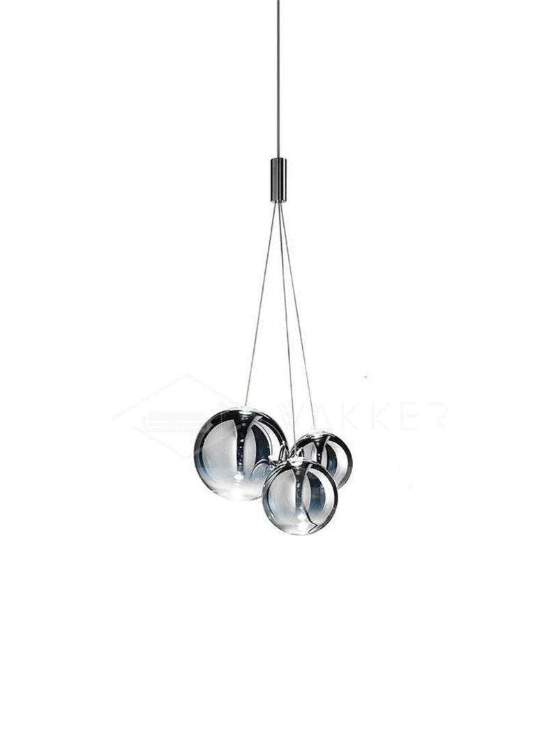 Smoke three-globe glass pendant on white, showing dark reflective spheres of different sizes below a chrome junction