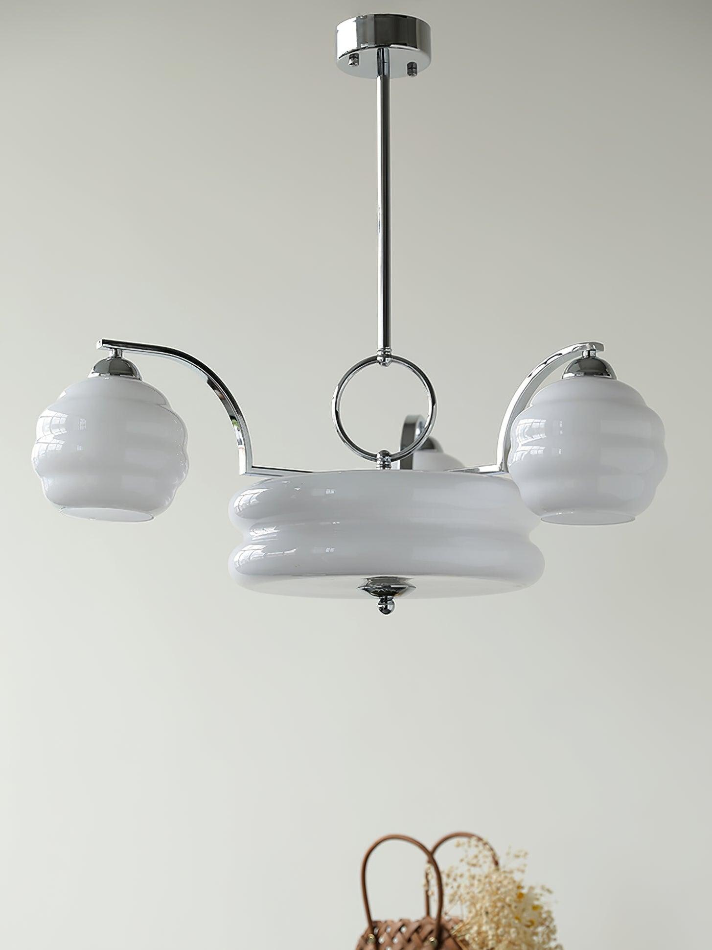 Chrome and White chandelier shown unlit
