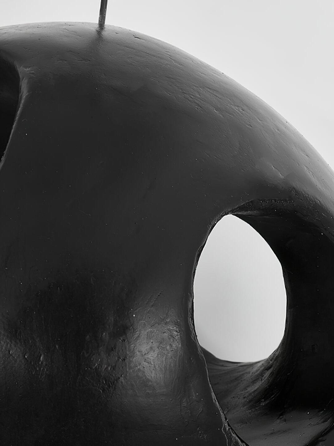 Close view of textured black shade and oval opening