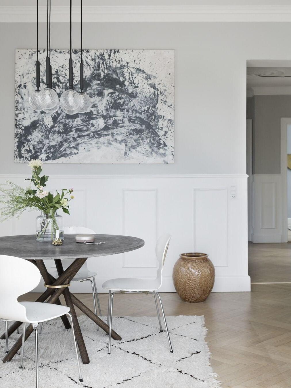 Separate globe pendants above a dining table
